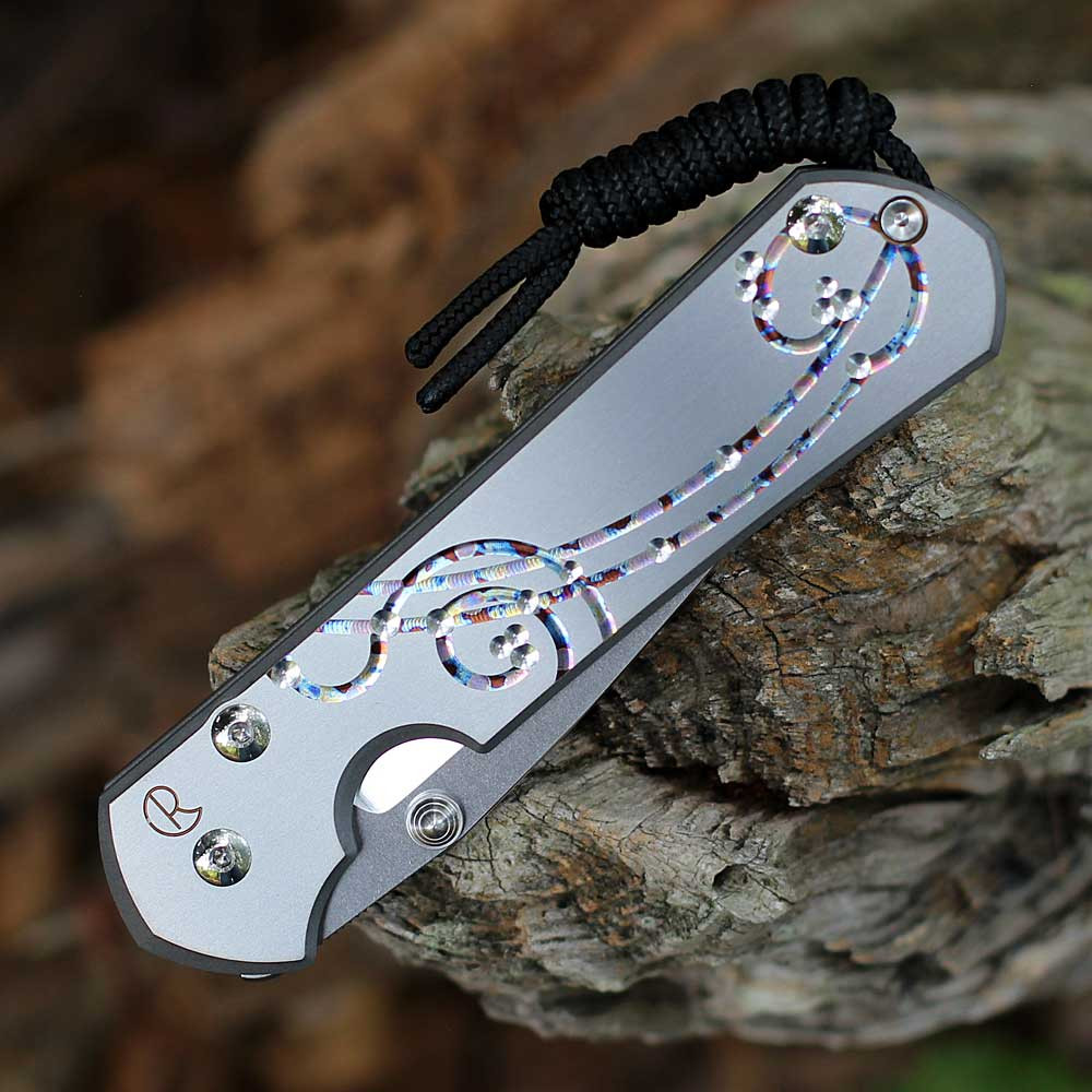 Chris Reeve Sebenza 31 Unique Graphic close-up of freehand-milled abstract titanium handle design.