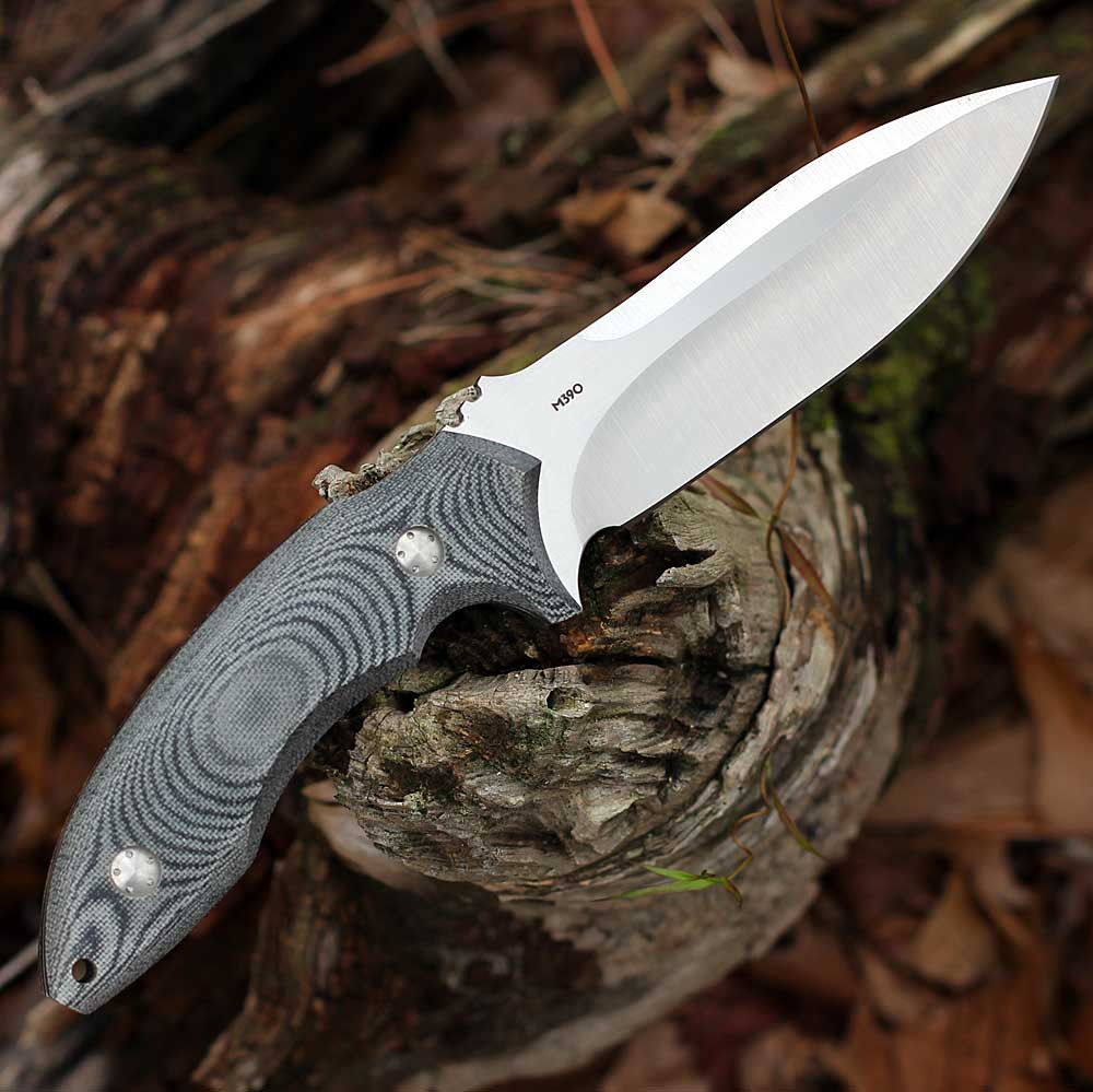 Heavily contoured 9mm canvas Micarta handle with proprietary fasteners