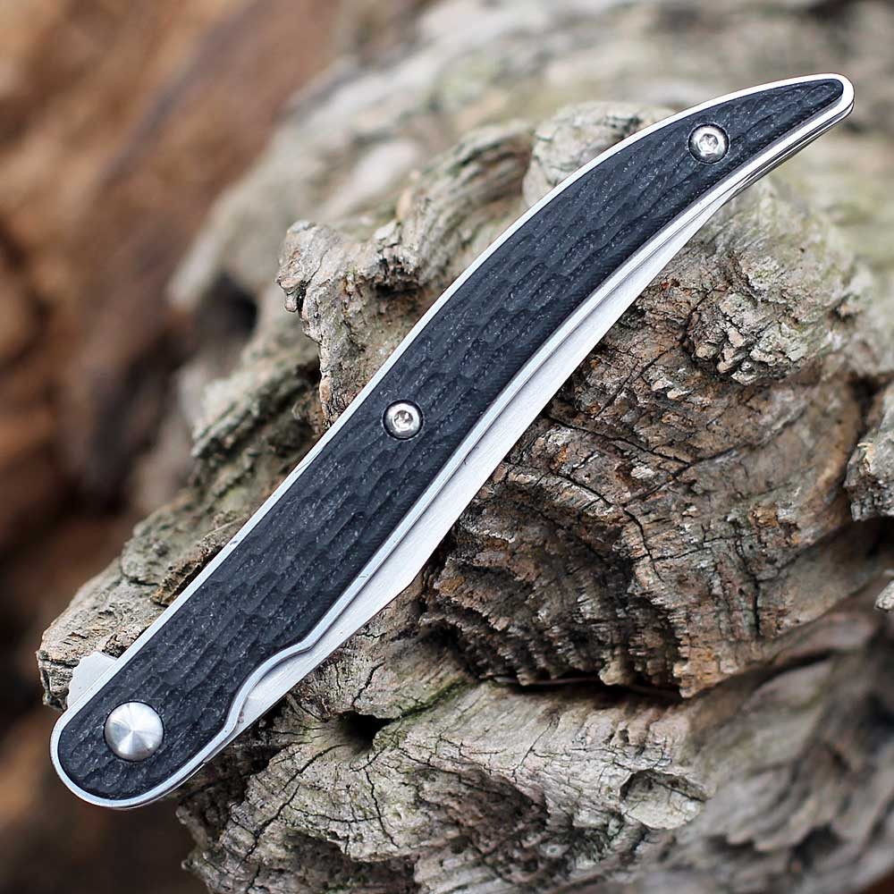 Close-up flipper tab and ball-bearing pivot on Boker Urban Texas Tooth Pick