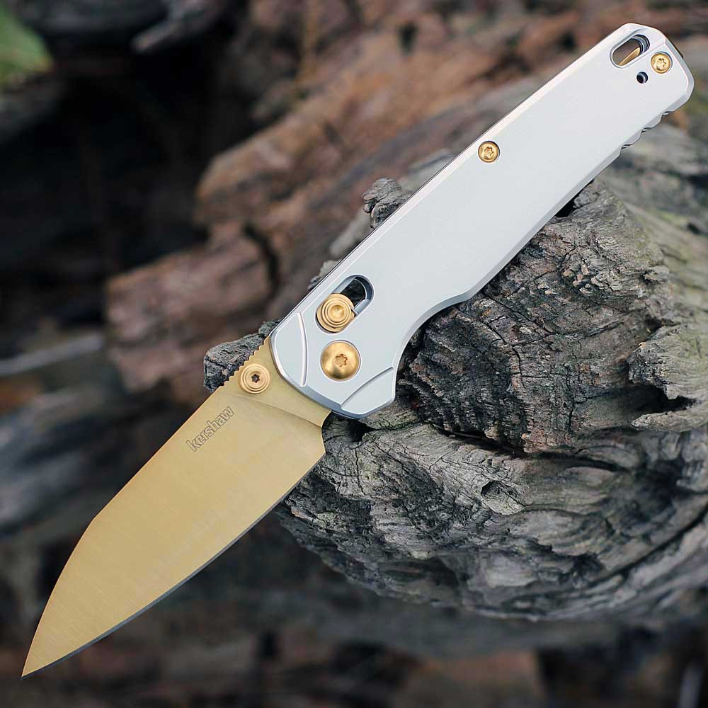 Kershaw Bel Air Aurum Raw 6105RAWGLD folding knife open view showing the 3.13-inch gold MagnaCut blade and raw aluminum handle.