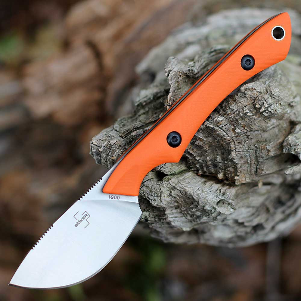 Boker Plus M.U.K. fixed blade knife showing the 2.36-inch satin skinner blade and orange G10 handle.