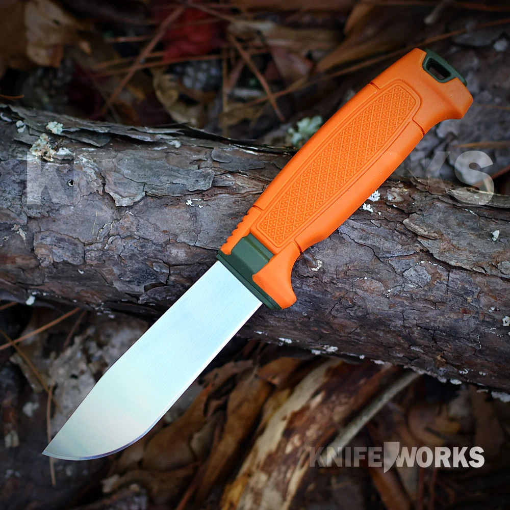 The Morakniv Amberg Full Flat Hunting (S) is shown with its stainless full flat ground blade and textured handle with a finger guard and lanyard hole. Its burnt orange Click-On sheath is shown alongside.