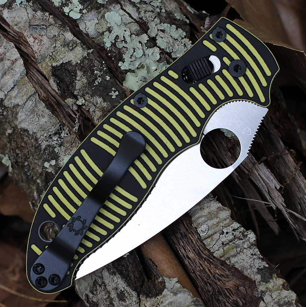 Spyderco Manix 2 Salt C101GBKYLMCP2 closed — black and yellow G-10 ribbed handle, Ball Bearing Lock, wire clip, Round Hole visible
