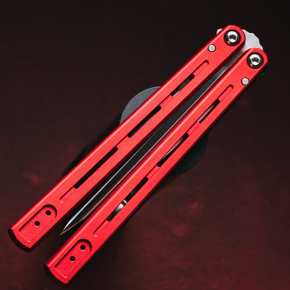 Pro-Tech Flyfather 2 FF2101-RED shown in the closed position against a dark red background. The two red anodized aluminum channel handles are closed together with the satin 154CM blade safely housed inside, and the short deep-carry clip is visible on the bite handle.
