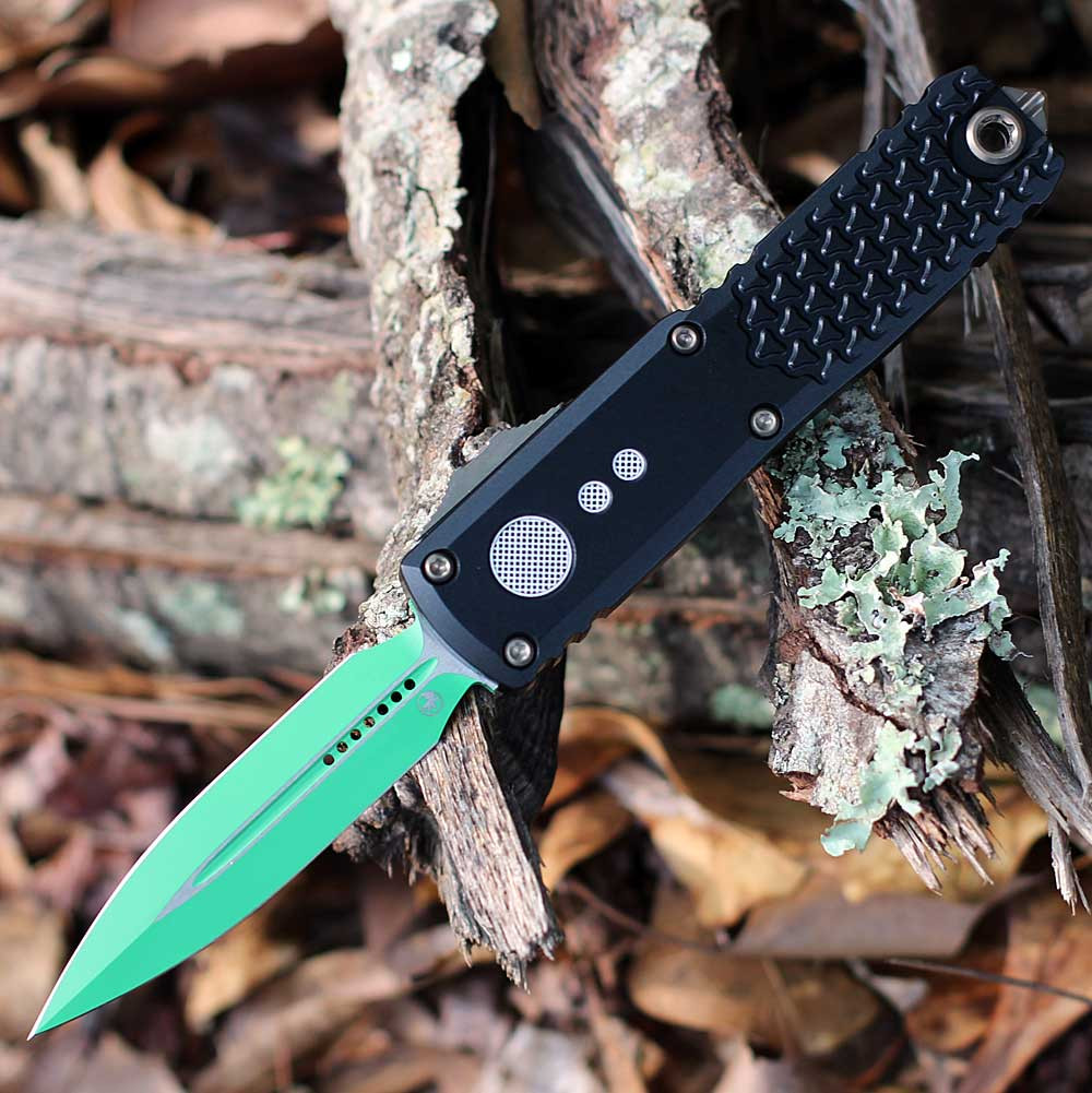 Microtech UTX-85 Gen IV 12321-1JM Jedi Master green double edge OTF auto — Bohler M390MK blade, black aluminum chassis, bronze hardware