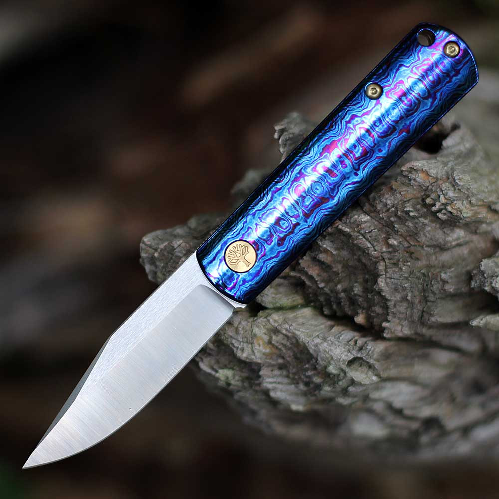 Boker Germany BRLW Mokuti 110674 open — CPM MagnaCut drop point blade, Mokuti violet blue iridescent handle, gold hardware, Liner Lock