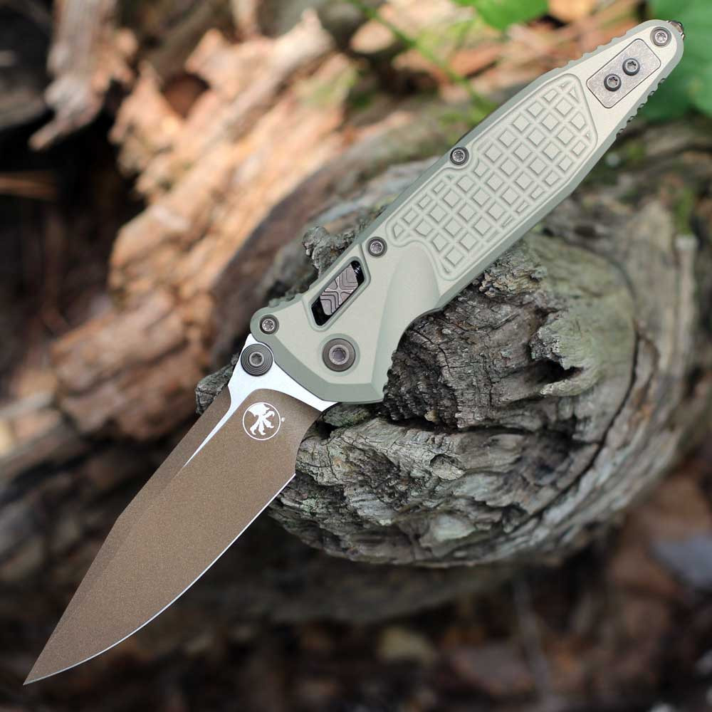 Microtech Socom RAM-LOK 160RL-1FRCG-C19Z23 — front view open, 3.80" M390MK bronze/satin two-tone clip point blade, champagne gold frag aluminum handle