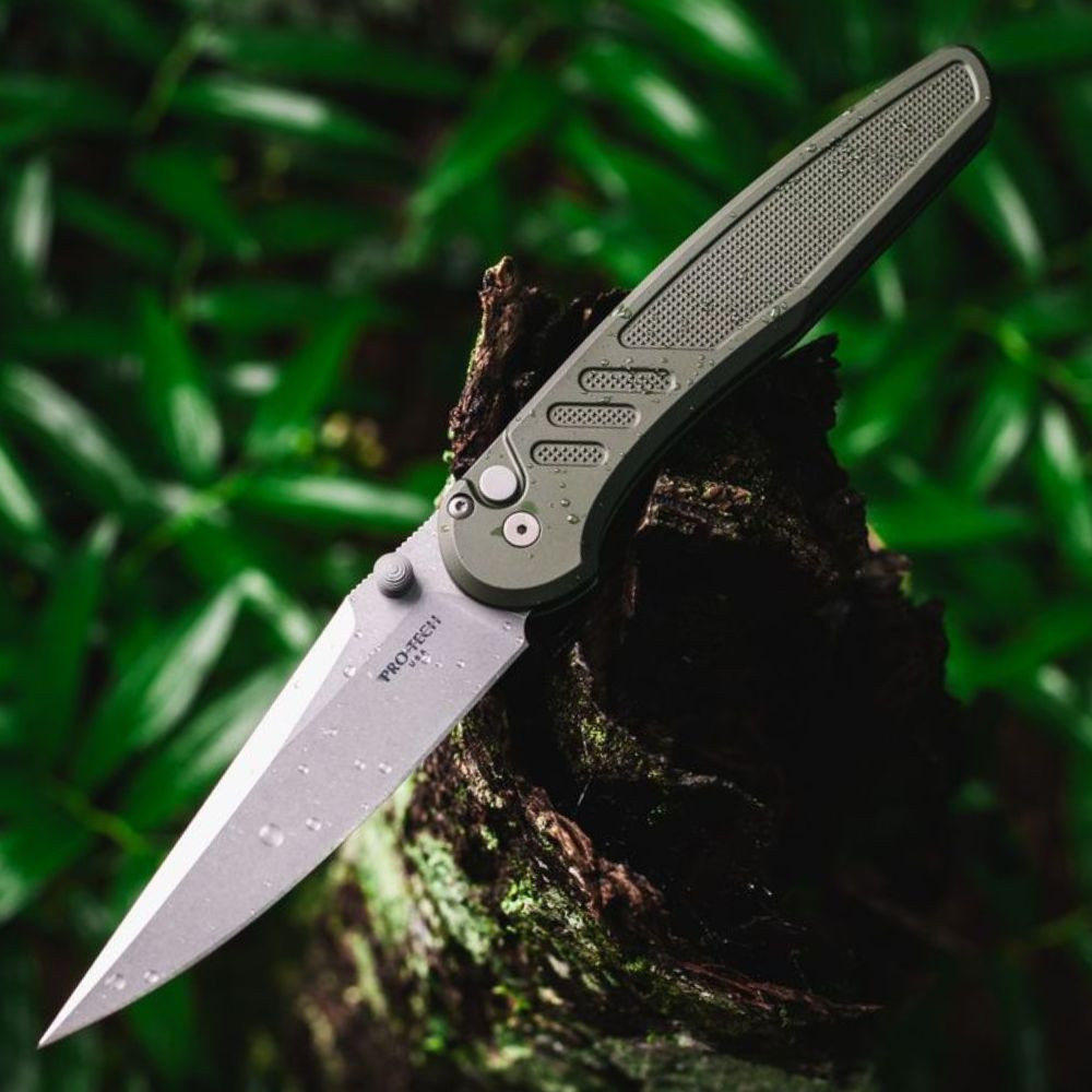 Pro-Tech Avalon Peace Neighbor PN1101-GREEN — open, 4.25" CPM-MagnaCut stonewash drop point blade extended, shown outdoors
