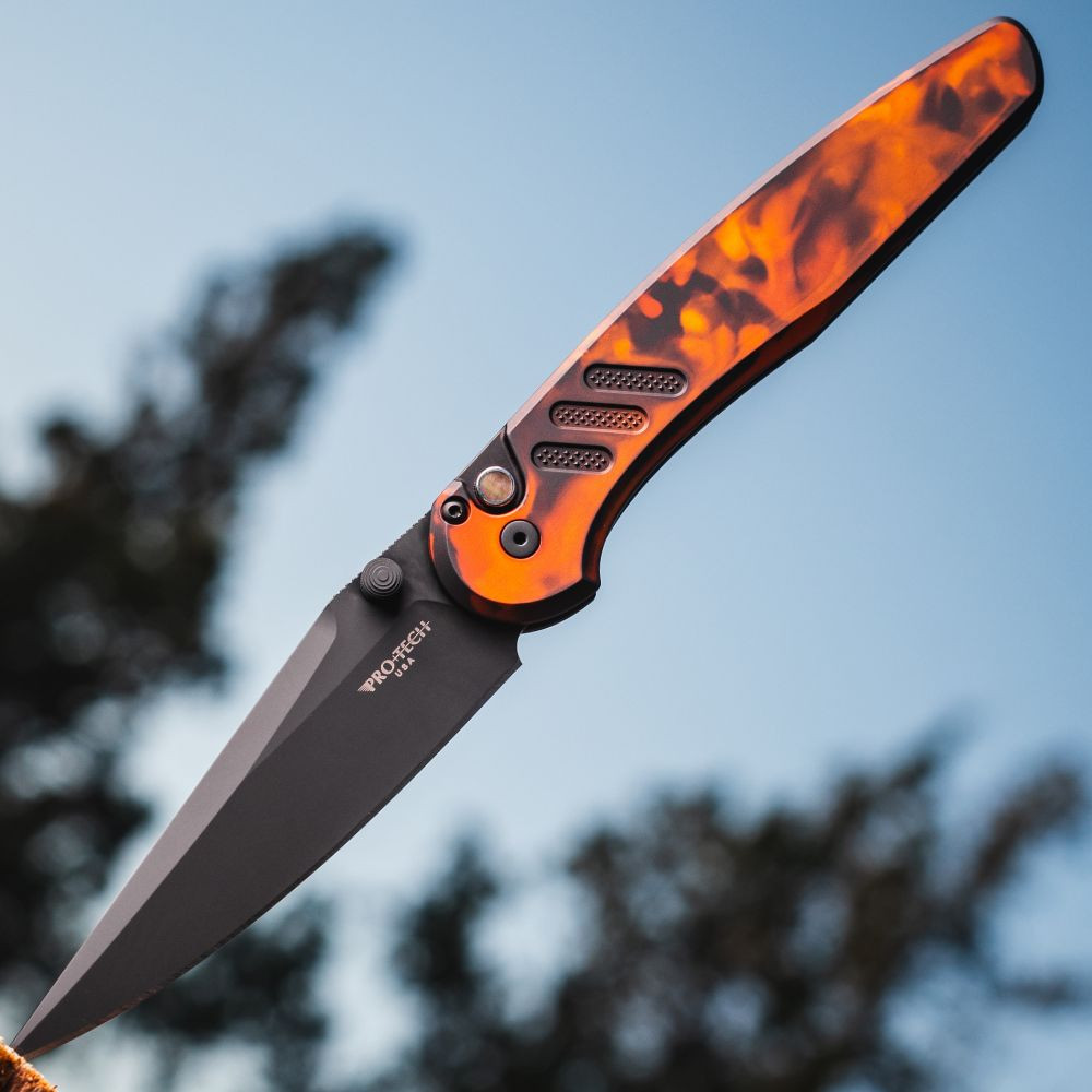 Pro-Tech Avalon Peace Neighbor "Del Fuego" PN1104-DF — open, DLC black blade extended, custom anodized aluminum handle outdoors