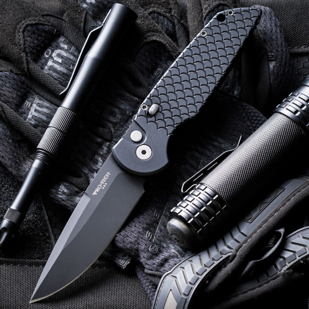 Pro-Tech TR-3 X1 Military Issue TR-3 X1 M — open, DLC black 154CM spear point blade extended, fish scale aluminum handle, tactical background