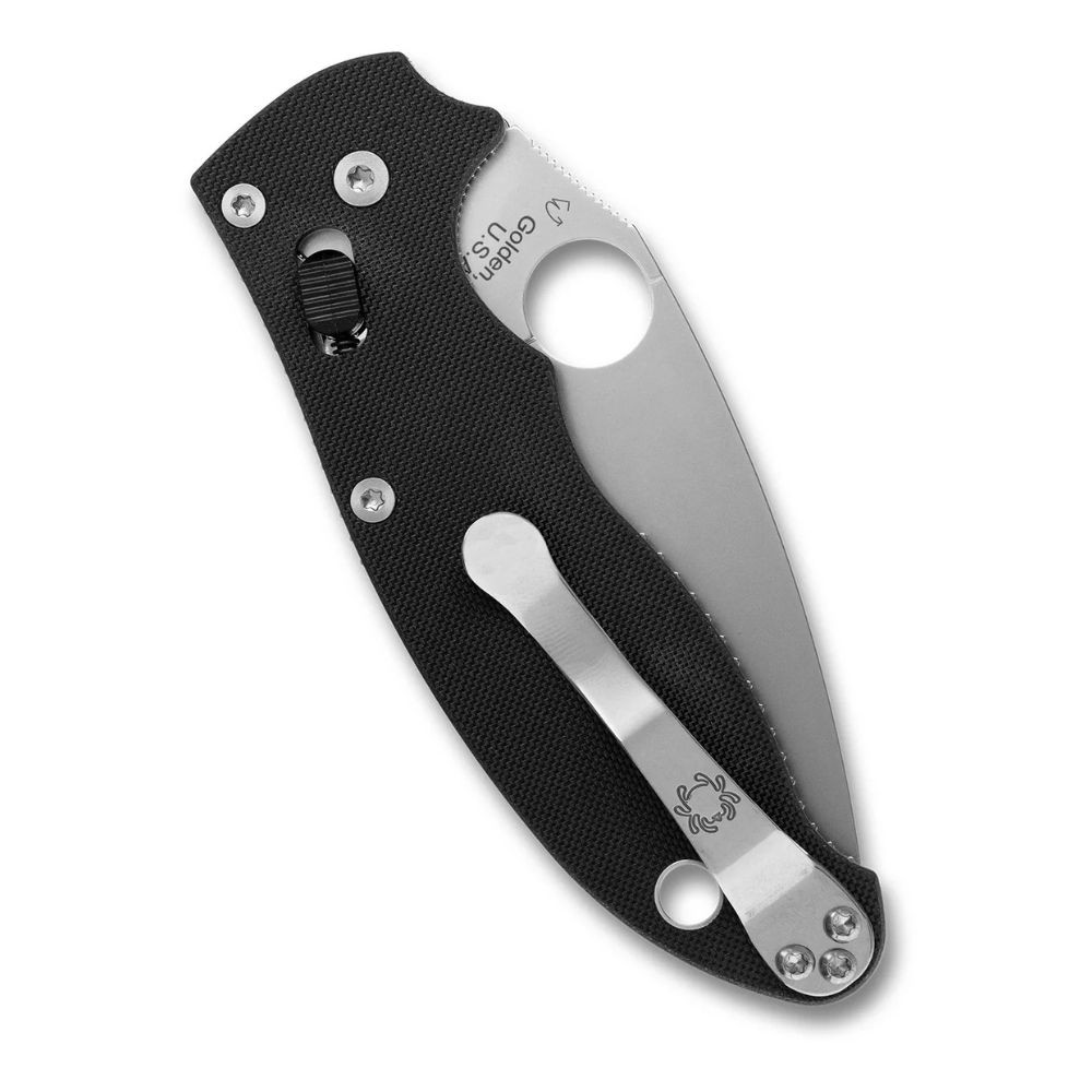 Spyderco Manix 2 (C101GP2) shown in the closed position against a white background. The peel-ply textured black G-10 handle with full stainless steel liners is visible. The reversible tip-up ambidextrous pocket clip rides on the spine. The Trademark Round Hole is partially visible at the pivot.