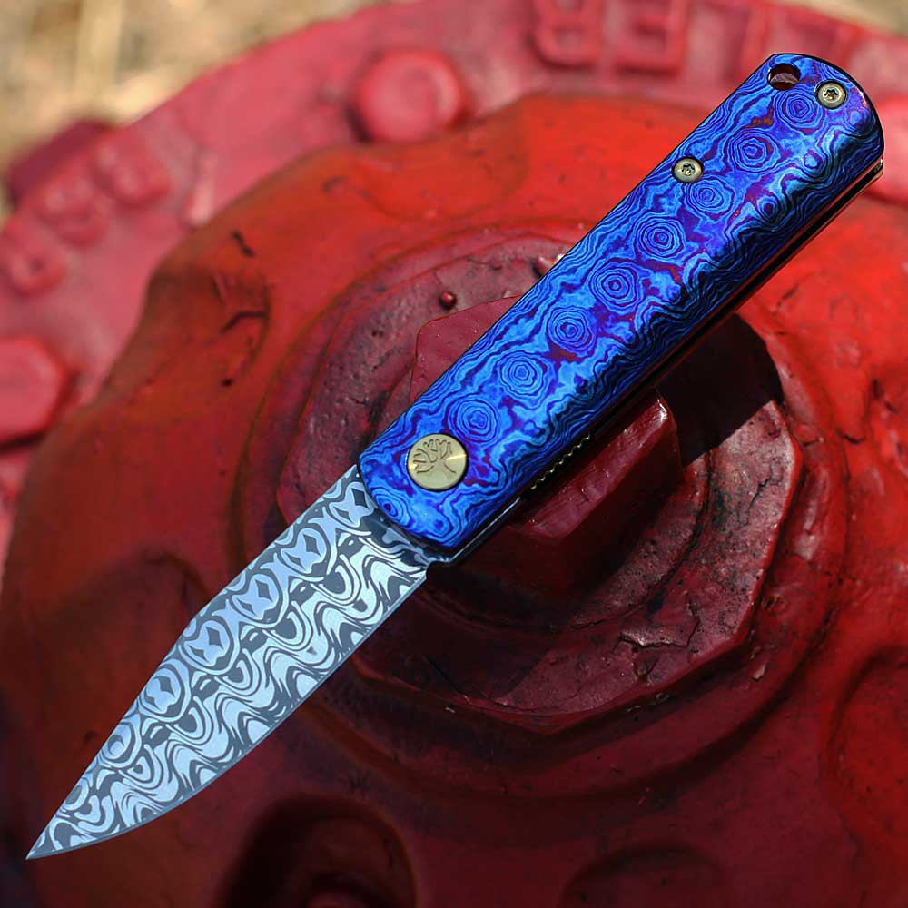 Boker Germany BRLW Fulldress 110675DAM open — Damasteel Nidhogg 264 layer Damascus drop point, Mokuti handle violet blue, gold hardware
