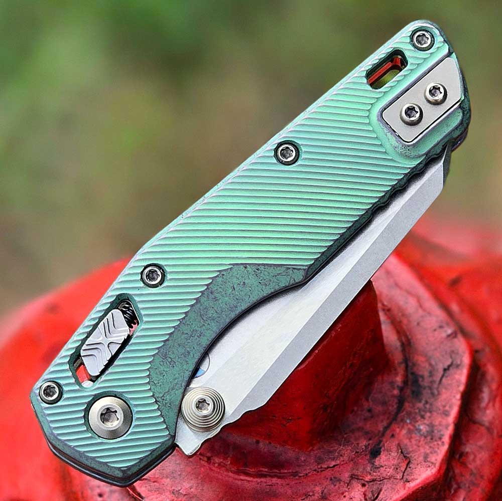 Microtech MSI Mini Ram-Lok Marfione Select closed, front view showing antique green fluted titanium handle and reversible pocket clip