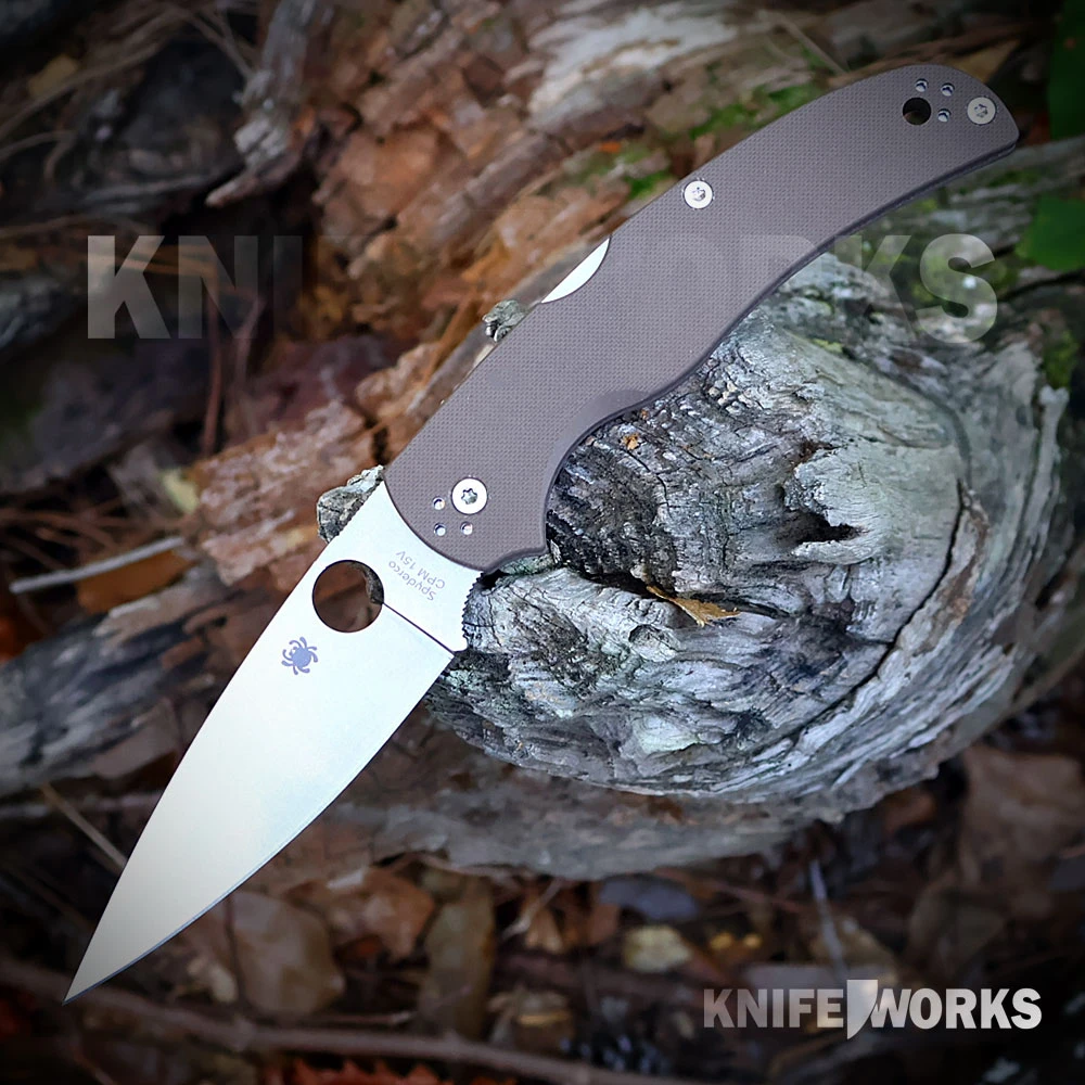 Spyderco Native Chief (C244GPBN15V) shown at an angle against a plain background. Features a 4.08-inch full-flat-ground CPM-15V blade with a laser-engraved "Triple B" logo on the reverse, brown peel-ply-textured G-10 handle scales with a linerless construction, and a stainless steel four-position pocket clip.