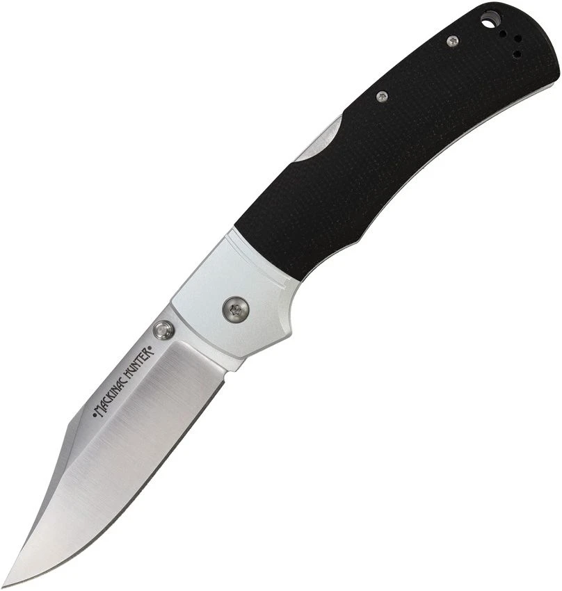The Cold Steel Mackinac Hunter (CS-FL-36MAK-BKST) shown with its 3.6-inch AUS-10A hollow-ground clip point blade, ergonomic black Micarta handle scales, and its ambidextrous thumb stud opener. The Tri-Ad® Lock mechanism is visible along the spine of this heritage-styled hunting folder.