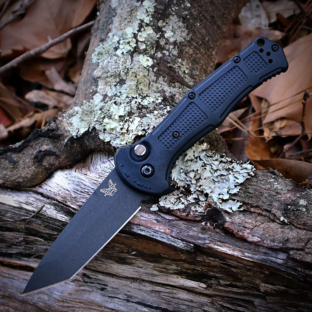 The Benchmade Claymore Auto (9071BK-02) shown with its 3.60-inch 154CM plain edge tanto blade in a Cobalt Black finish and flat grind, Black Grivory handle with deeply molded texture, and its reversible deep-carry tip-up pocket clip. The push button with integrated safety lock is visible on this automatic knife. ⚠️ Verify legal status in your jurisdiction before purchasing.