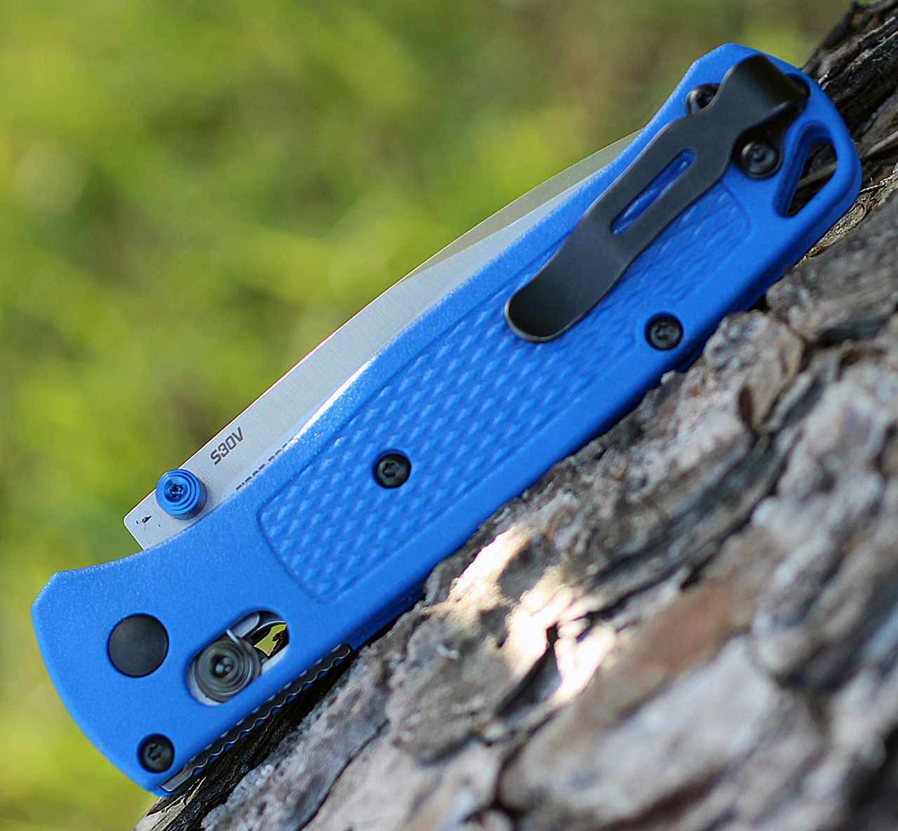 Ultralight blue Grivory handle folder with blue titanium thumb studs