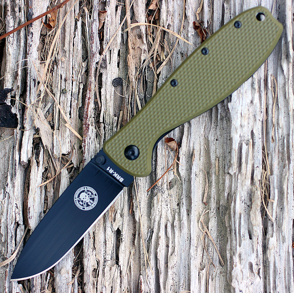 The ESEE Zancudo (BRKR2ODB) shown with its 2.94-inch D2 drop point blade in a black finish and flat grind, OD Green polymer handle with steel frame lock, and reversible pocket clip for tip-up or tip-down carry.