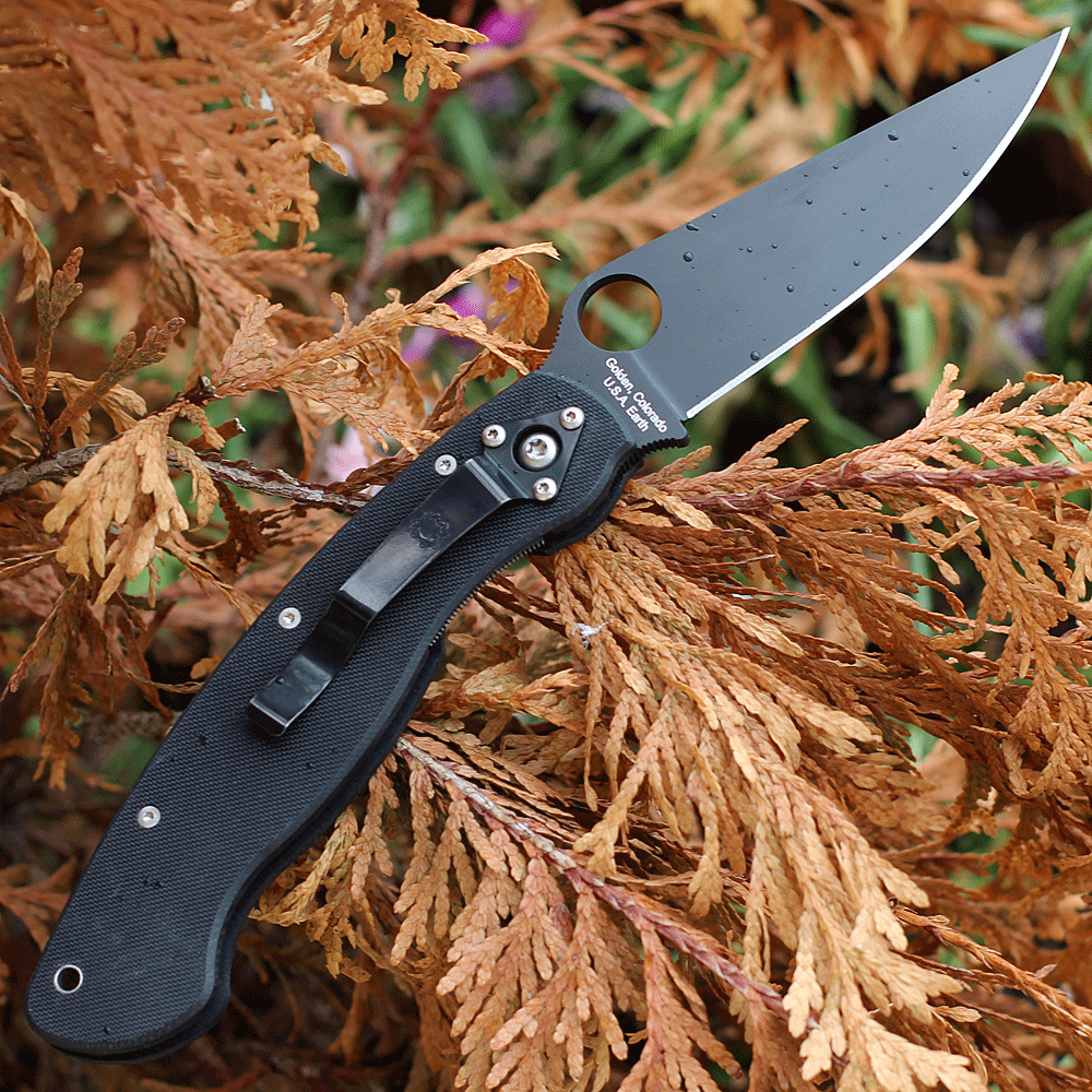 Close‑up CPM S30V DLC clip‑point blade and 14mm Round Hole on Spyderco Military