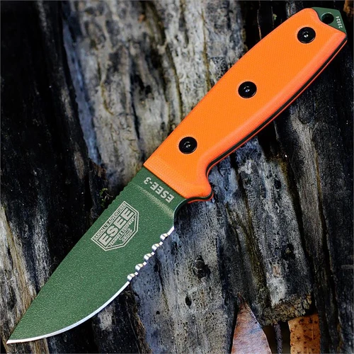 The ESEE-3 (ESEE-3S-KO-OD) shown with its 3.88-inch 1095 part serrated drop point blade in an OD Green finish and flat grind, orange G-10 handle scales. This is a knife-only listing — no sheath is included.