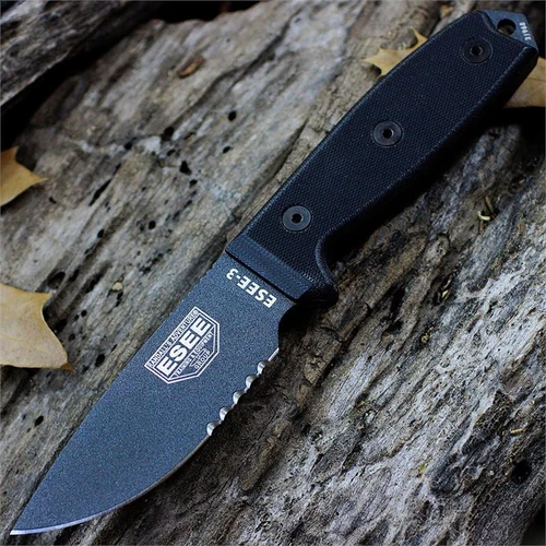 The ESEE-3 (ESEE-3S-TG) shown with its 3.88-inch 1095 part serrated drop point blade in a Tactical Gray finish and flat grind, black G-10 handle scales, and its injection-molded black plastic sheath.
