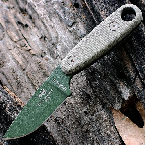 The ESEE Izula II Survival Kit (IZULA-II-OD-KIT) shown with its 2.63-inch 1095 plain edge drop point blade in an OD Green finish and flat grind, tan Micarta handle, black polymer sheath, and the full kit: paracord, cord lock, split rings, ferro rod, whistle, and snap hook.
