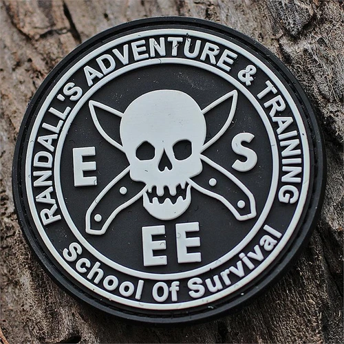 The ESEE RAT Patch (ESEE-RAT-PATCH), the Randall's Adventure & Training School of Survival patch, in black PVC with Velcro backing and a 2.5-inch diameter.
