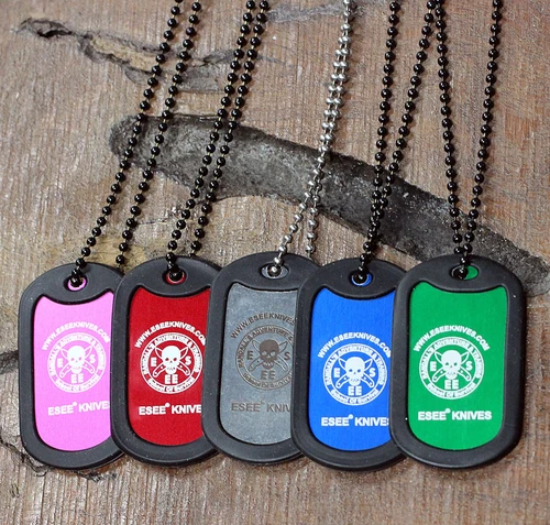 The ESEE Dog Tag (ESEE-TAGBLU), a Knifeworks Exclusive, shown in blue aluminum inside a black rubber protective casing on a 24-inch ball chain.
