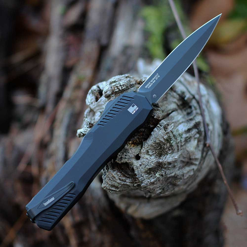 Rear view showing the reversible black deep-carry pocket clip and black oxide screws on the 9000DE.