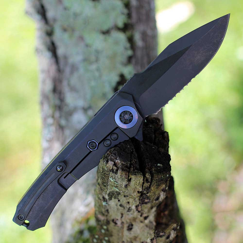 Heretic Knives Wraith Manual Flipper (H001-6B-BLUTI) 3.62" Magancut Clip Point Battleworn Black Part Serrated Blade, Titanium Chassis, Carbon Fiber Front Scale with Blue Titanium Accents, Battleworn Black Titanium Back