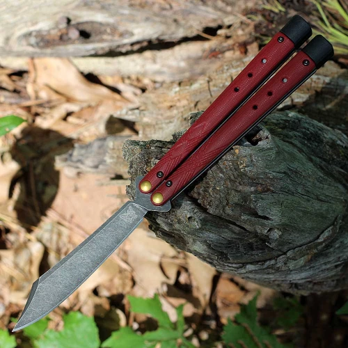 The Benchmade Necron Bali-Song BM99BK-1 is shown open, featuring a 4.59-inch blackwashed CPM-S30V scimitar blade extending from Ruby Red G-10 handle scales with adjustable tungsten weights and handle extensions.