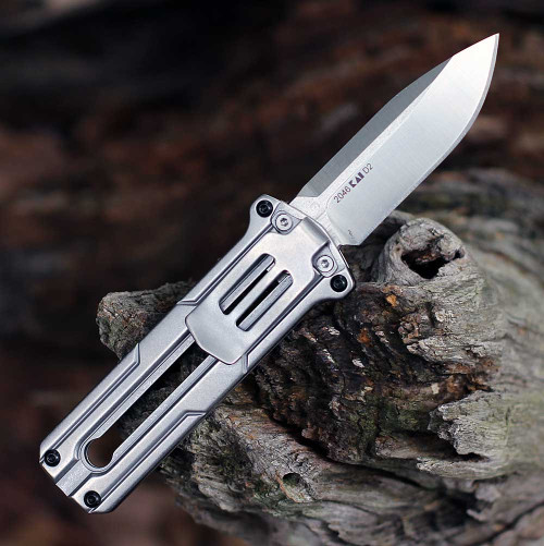 he Kershaw Cybernet being manually deployed highlighting the sliding mechanism and compact 5.95-inch overall length.