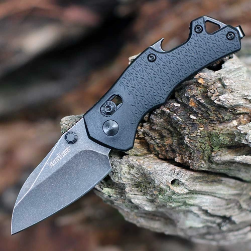 Kershaw Craze 8337 folding knife profile view showing the 2.35-inch BlackWash reverse tanto blade and black handle.