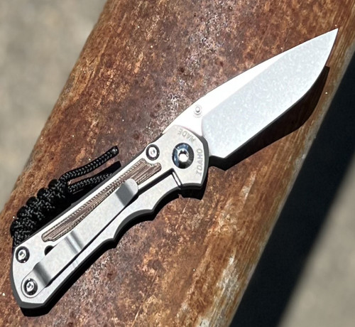 CPM MagnaCut stonewashed drop point blade close up
