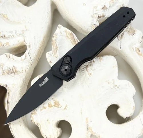 Kershaw Launch 18 7551BLK automatic knife profile view showing the 2.75-inch black drop point blade and black handle.