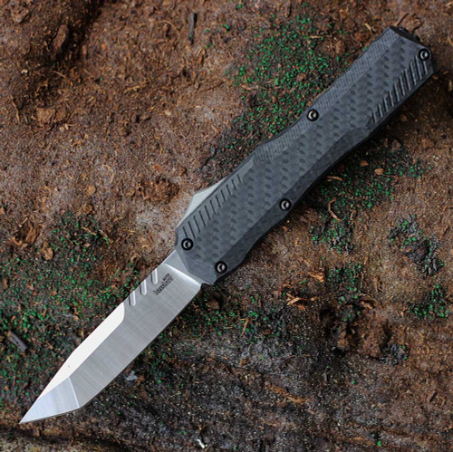 Kershaw Livewire 9000TCF OTF automatic knife open view showing the 3.3-inch satin tanto MagnaCut blade and carbon fiber handle.