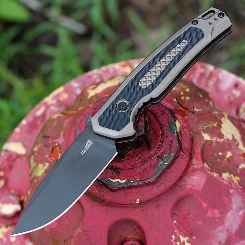 Kershaw Launch 21 7106 automatic knife open view showing the 3.45-inch black PVD blade and FDE handle with G-10 inlays.