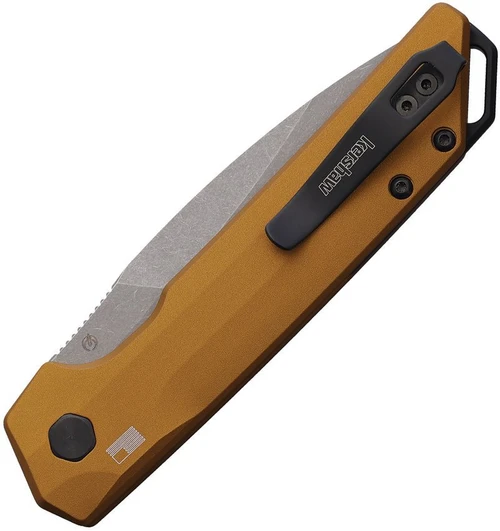 Detailed close-up of the bronze-anodized aluminum handle, black pivot hardware, and the low-profile firing button.