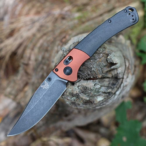 The Benchmade Crooked River 15080BK-04 is shown open, featuring a 4.00-inch Black Stonewash CPM-MagnaCut clip point blade extending from a Green Canvas Micarta handle with anodized bolsters, dual thumb studs, and AXIS Lock mechanism.