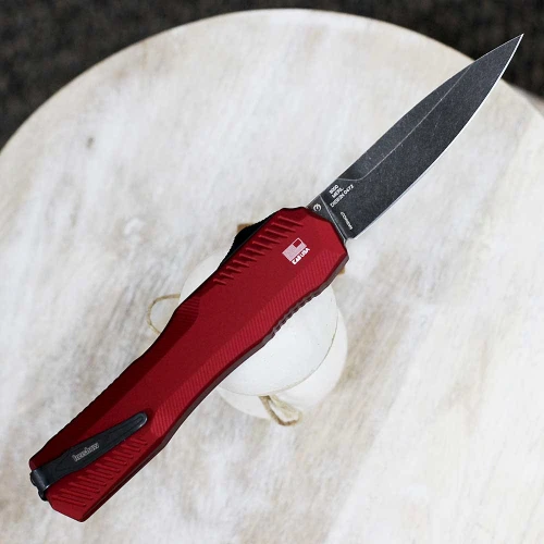 The Kershaw Livewire Napa Merlo being deployed highlighting the snappy double-action and 8.1-inch overall length.