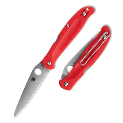 The Spyderco Charisma C259PRD is shown open and closed side by side on a white background. The open knife displays the leaf-shaped blade with its Spyderco Round Hole and bug logo, and the closed knife shows the red FRN handle's grooved texture, wire pocket clip, and Golden, USA blade stamp.