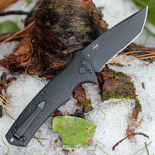 Black D2 tool steel serrated Tanto blade close up