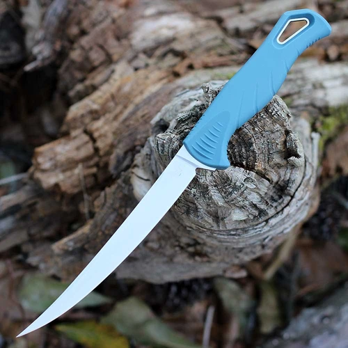 The Benchmade Fishcrafter (18030) shown with its 5.00-inch CPM MagnaCut trailing point blade in a satin finish and hollow grind, Depth Blue Santoprene rubber-overmolded handle, and its Sonar Gray injection molded polymer sheath. The tip sweeps above the centerline, concentrating the cutting edge in the belly for efficient fillet and skinning strokes.