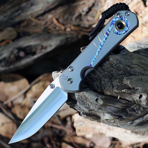 Chris Reeve Large Sebenza 31 Unique Graphic L31-1408-0796 showing the Onyx Cabochon thumb stud.