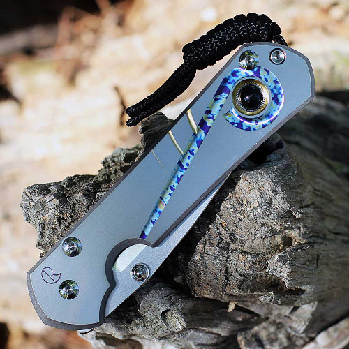 Chris Reeve Sebenza 31 showing the Unique Graphic titanium handle and silver hardware.