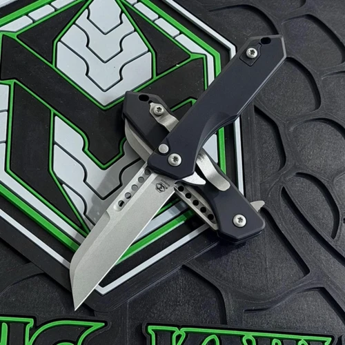 Heretic Jinn button lock flipper knife battleworn MagnaCut Wharncliffe blade front view