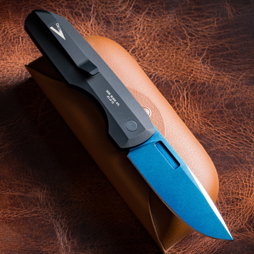 Pro-Tech VERO Synapse BSA26.VERO.1 shown open on a brown leather background at a closer angle, highlighting the blue linen micarta lid scales and black aluminum thickback handle construction. The abalone button and the contrast between the aluminum spine and micarta scales are clearly visible.