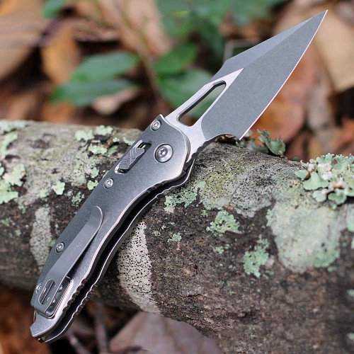 Microtech Mini Stitch RAM-LOK 169MRL-10MS1 Bohler M390MK stonewash spear point blade close-up — slab side titanium handle, bronze accent hardware visible
