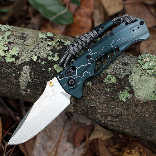 Benchmade Mini Adira 18065-ABEL1 closed — Abel Dark Waters Lightning teal anodized aluminum handle, paracord lanyard, AXIS Lock, gold thumb stud