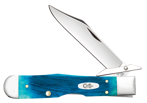 Case Cheetah Cub (25578) shown open with the clip point blade extended upward, revealing the swing guard at the pivot and the "Case Bros. USA" tang stamp. The Sawcut jigged Caribbean Blue Bone handle scales show deep blue coloring with natural texture and lighter mottling throughout. Nickel silver bolsters cap each end of the handle, brass pins run along the spine, and an oval Case shield with the script logo sits centered on the show side.